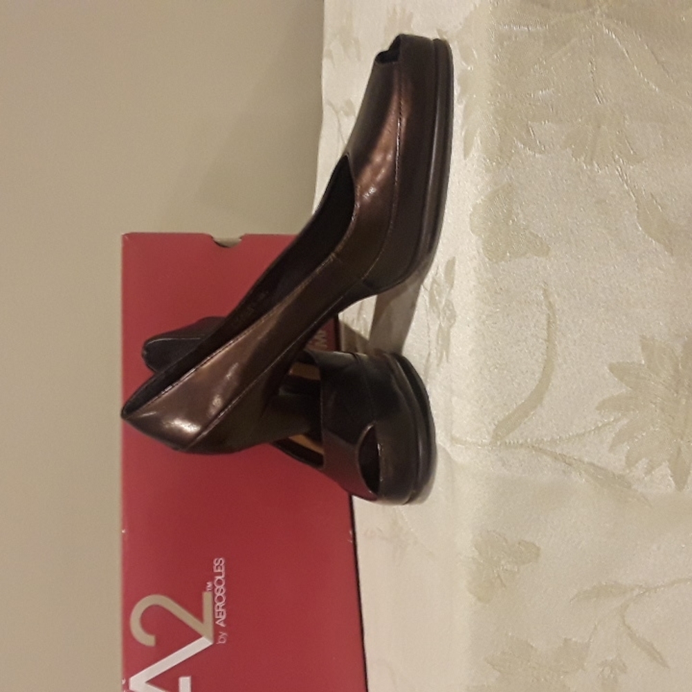 Bronze peep toe heels.